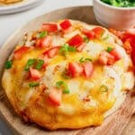Copycat Taco Bell Mexican Pizza Mexican pizza on a wooden cutting board.