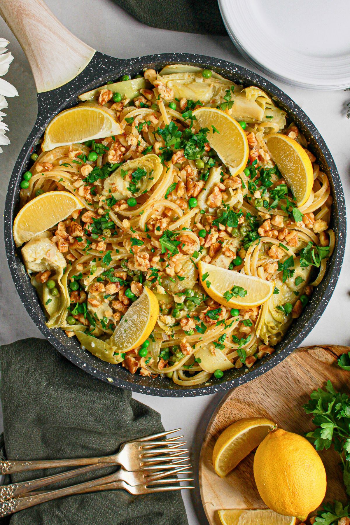 Spaghetti noodles and vegetables in a large skillet.