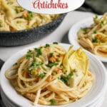 Small plate full of pasta with artichokes.