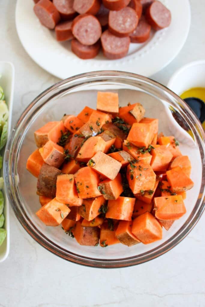 Diced sweet potatoes in a glass bowl.