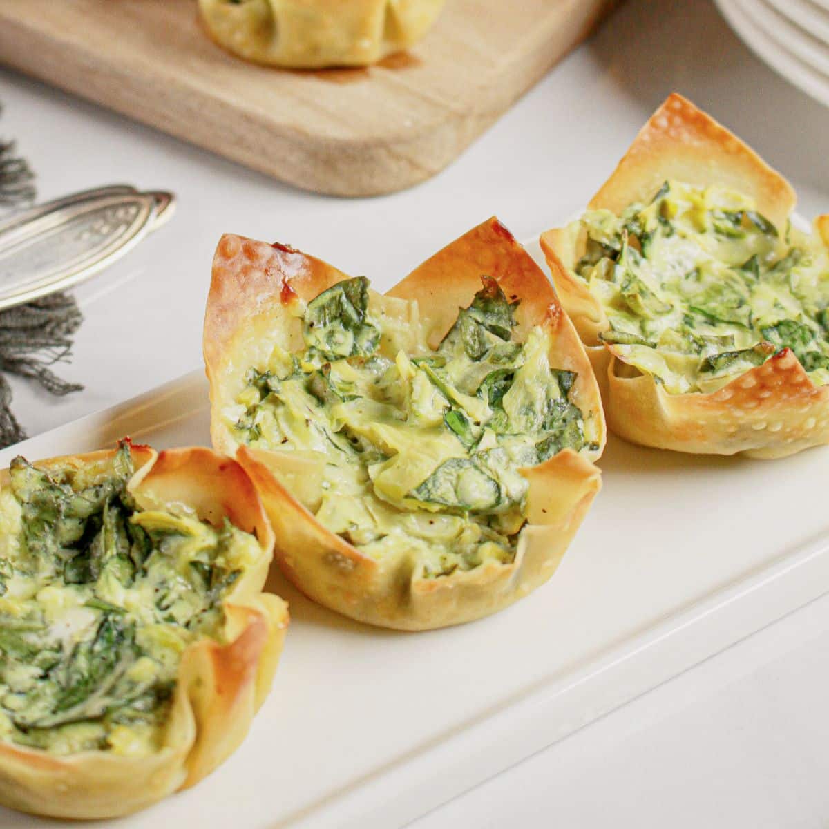 Spinach Artichoke Wonton Cups on a platter.