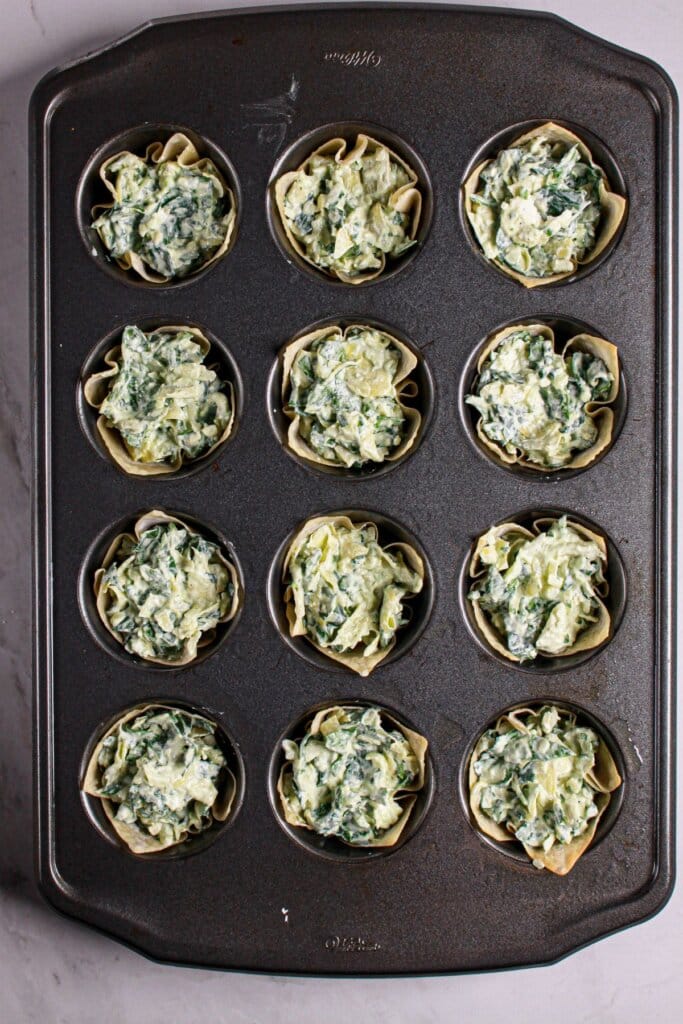Appetizer in a cupcake pan ready for the oven.