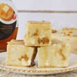 Syrup and Waffles Fudge Three pieces of fudge on a white and gold plate.
