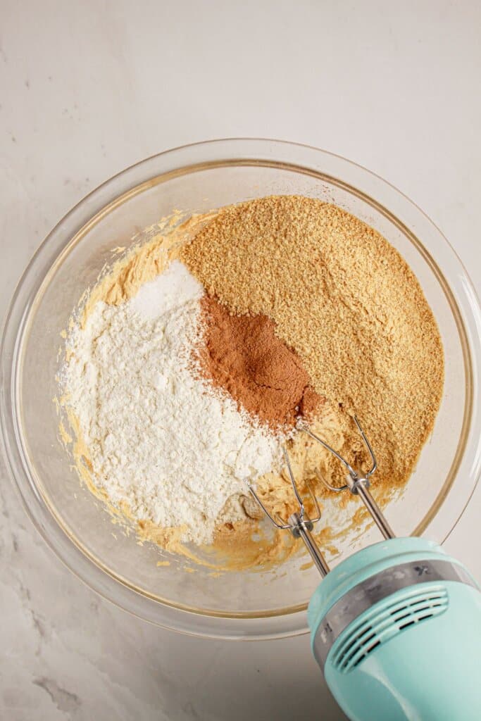 Crust ingredients being mixed in a glass bowl.