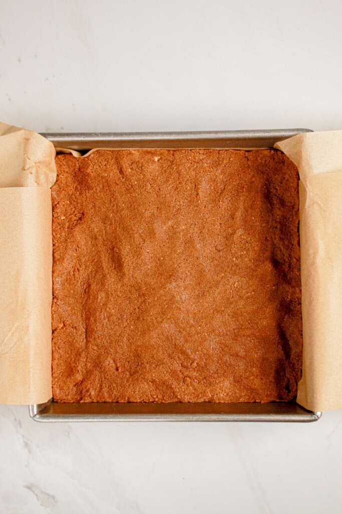 Crust pressed into the bottom of a baking dish.