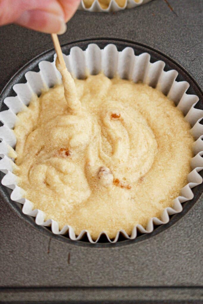 Cookie crumb being swirled with a toothpick.