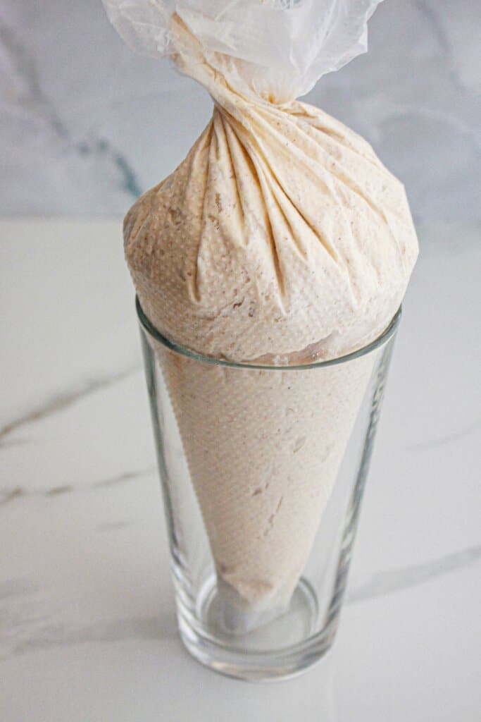 Frosting bag in a glass.