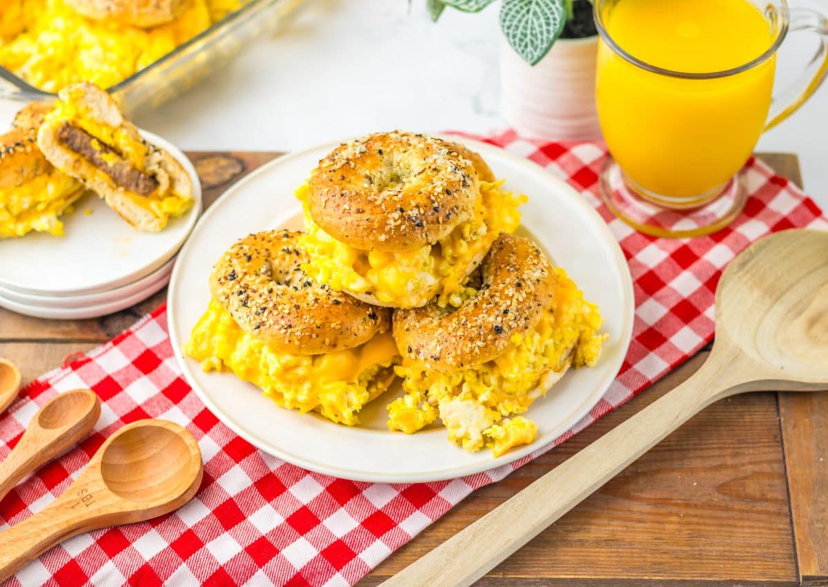 Three breakfast bagel sliders on a plate.