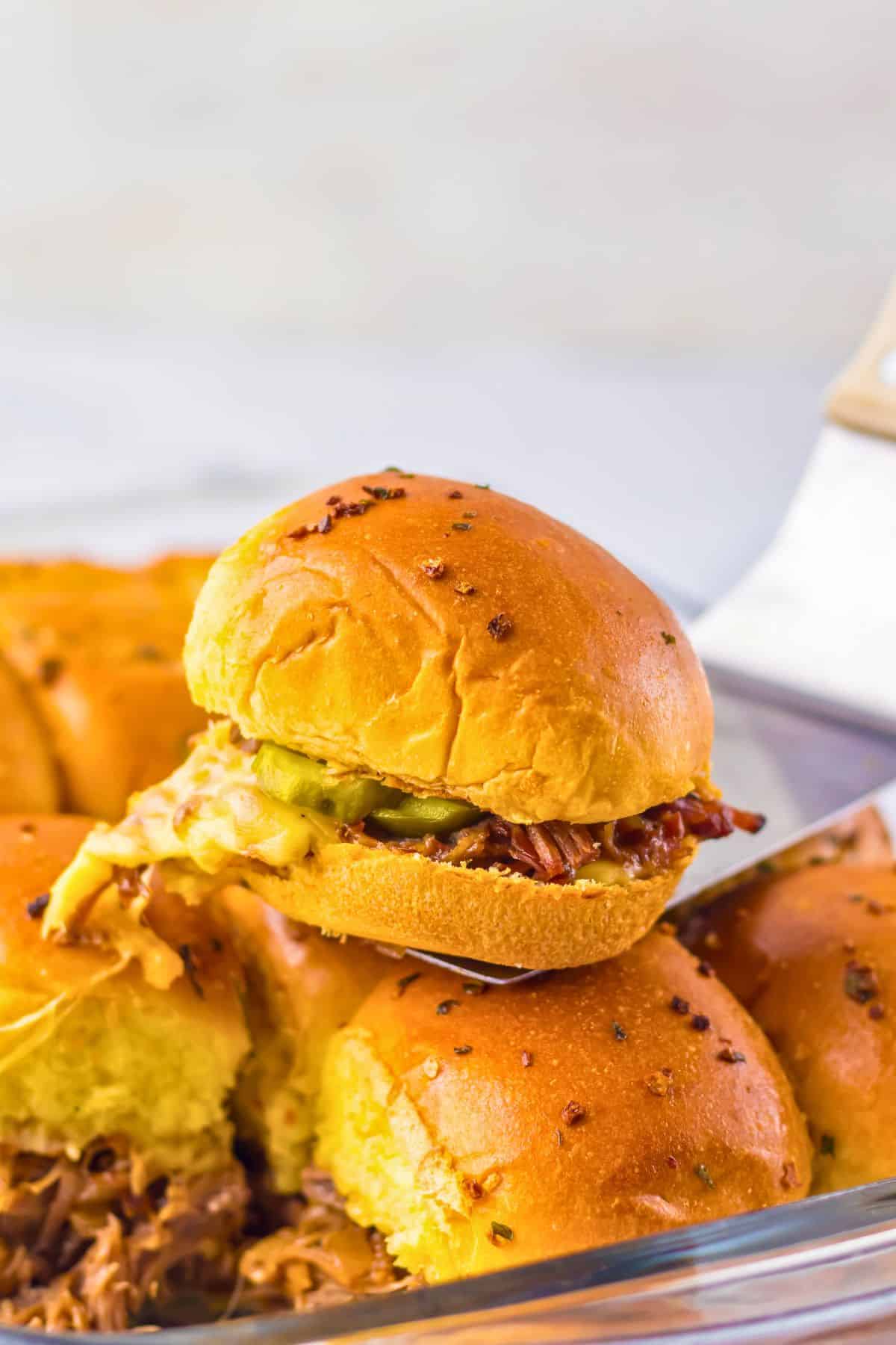 Brisket slider on a spatula.