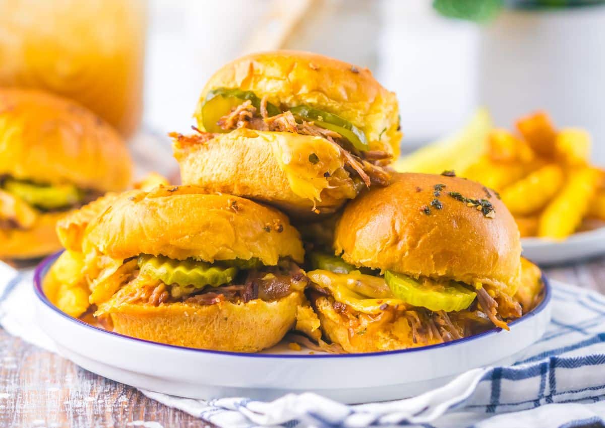 Three brisket sliders on a plate.