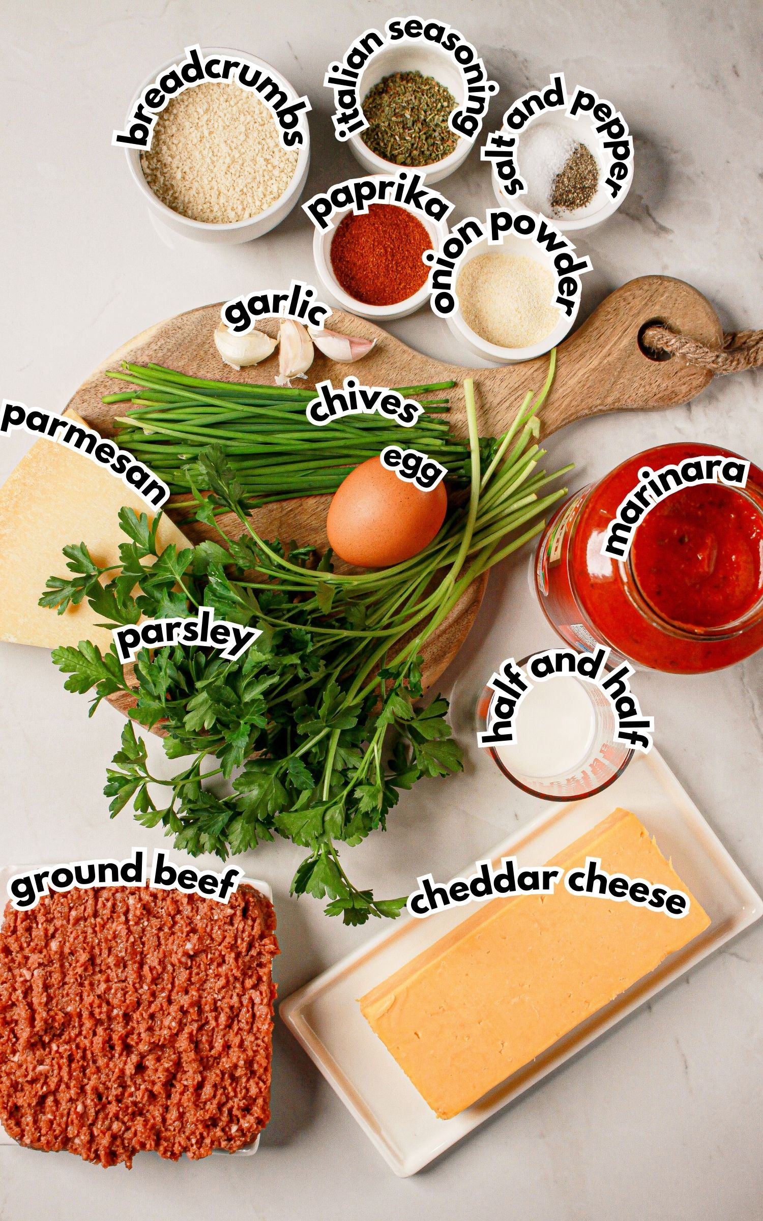 Bowls of ingredients labelled with text on a counter.