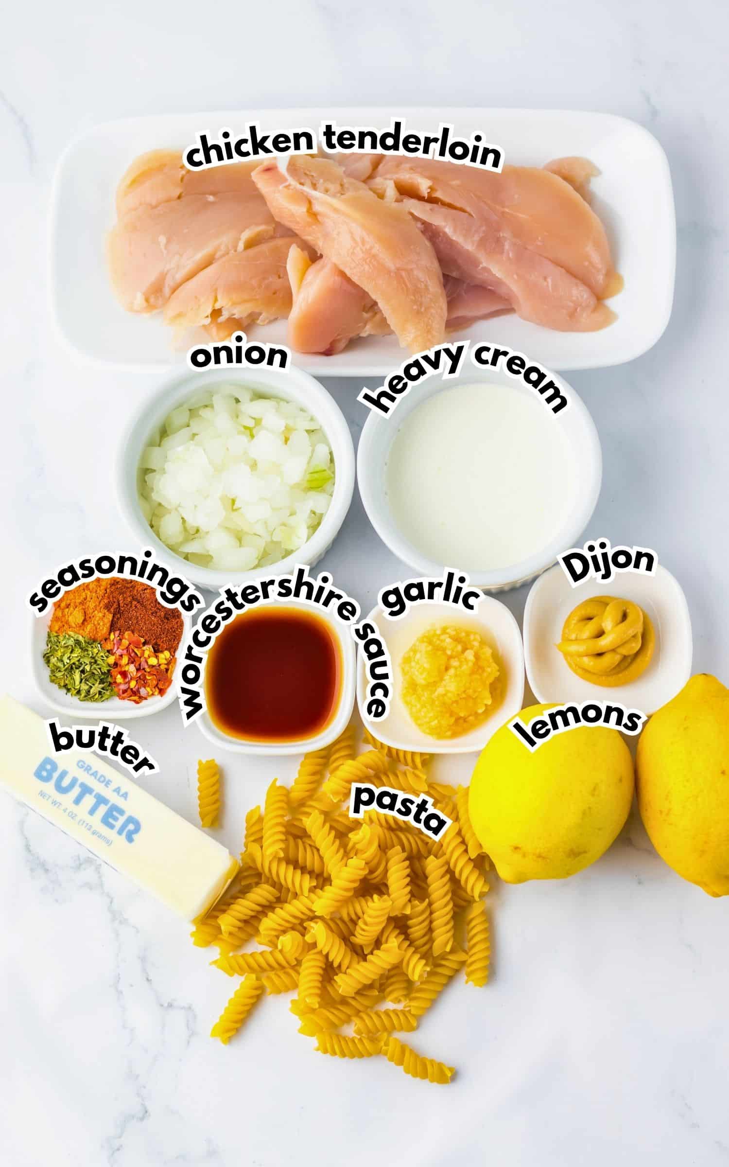 Bowls of ingredients labelled with text on a counter.