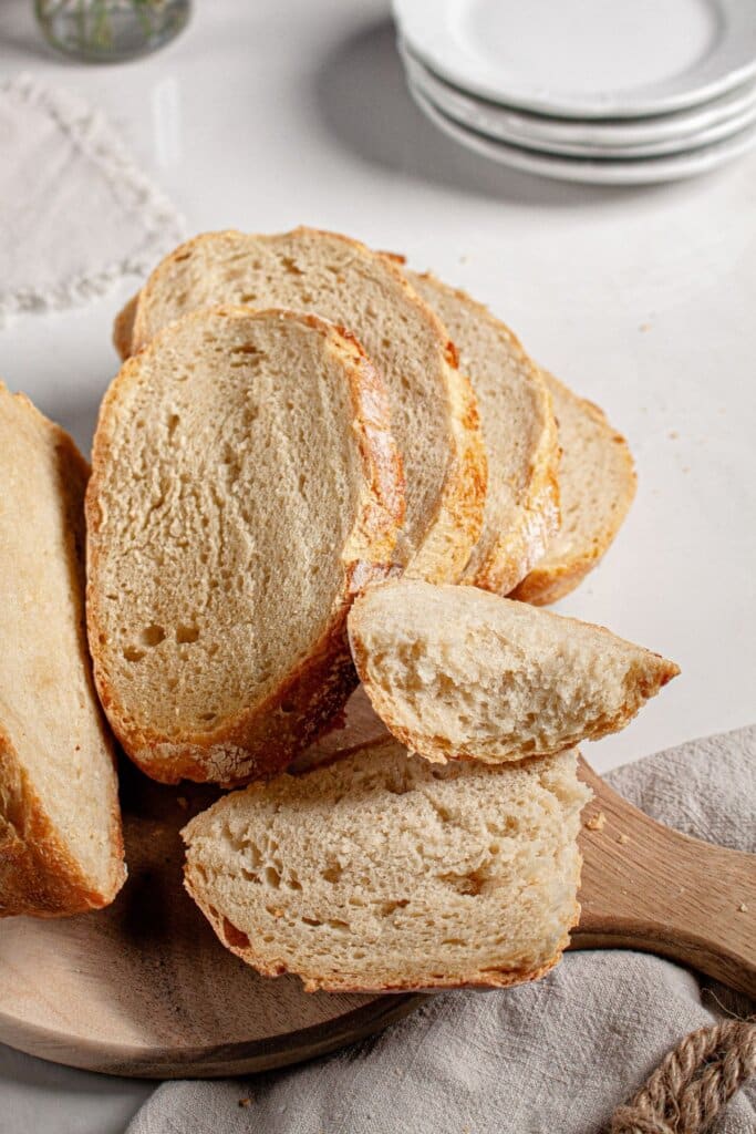 Slices of sourdough bread on a cutting board.