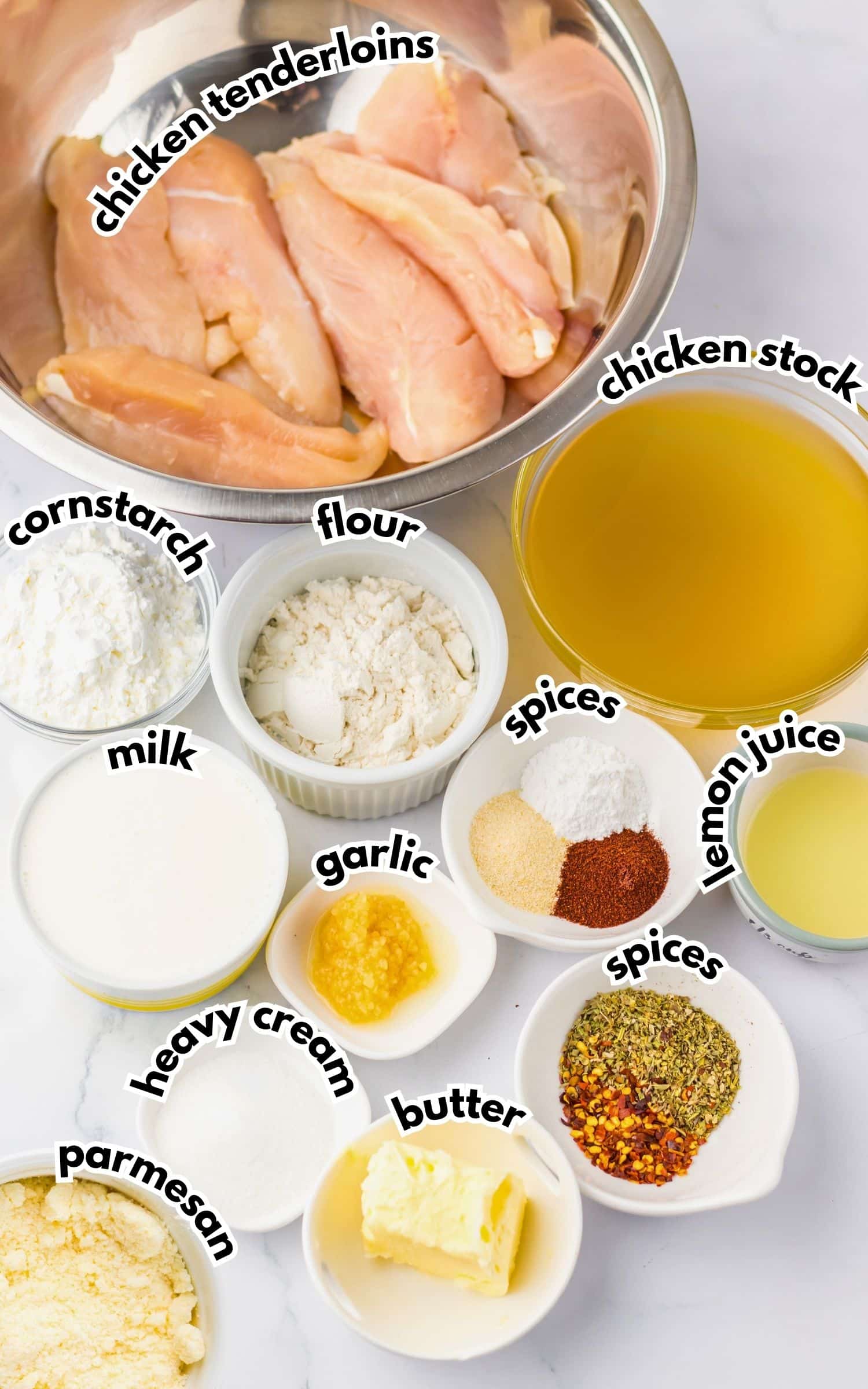 Bowls of ingredients labelled with text on a counter.