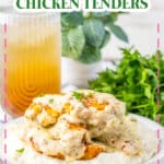 Garlic parmesan chicken tenders on a bed of mashed potatoes on a white plate.