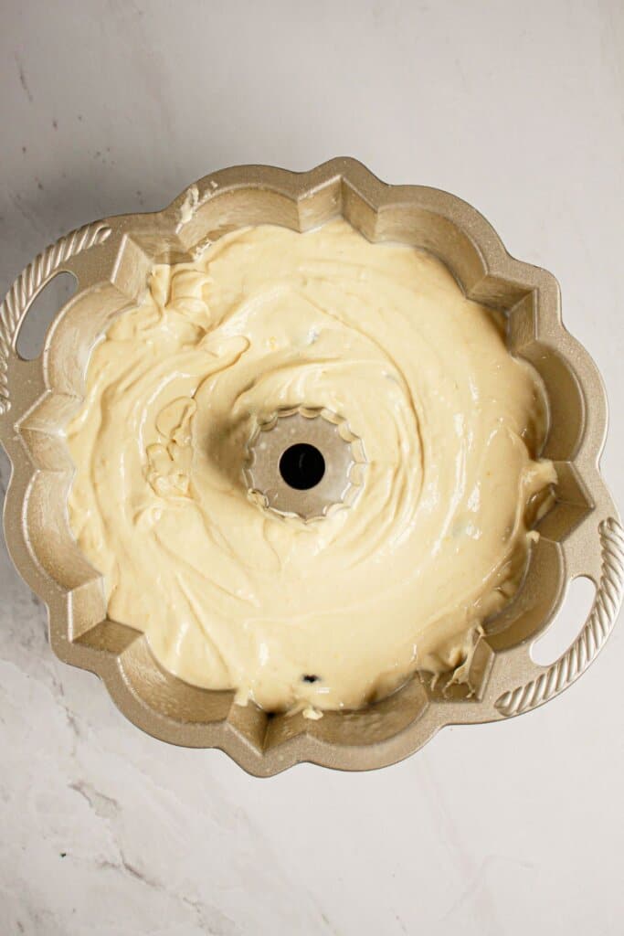 Batter in a cake pan ready for the oven.