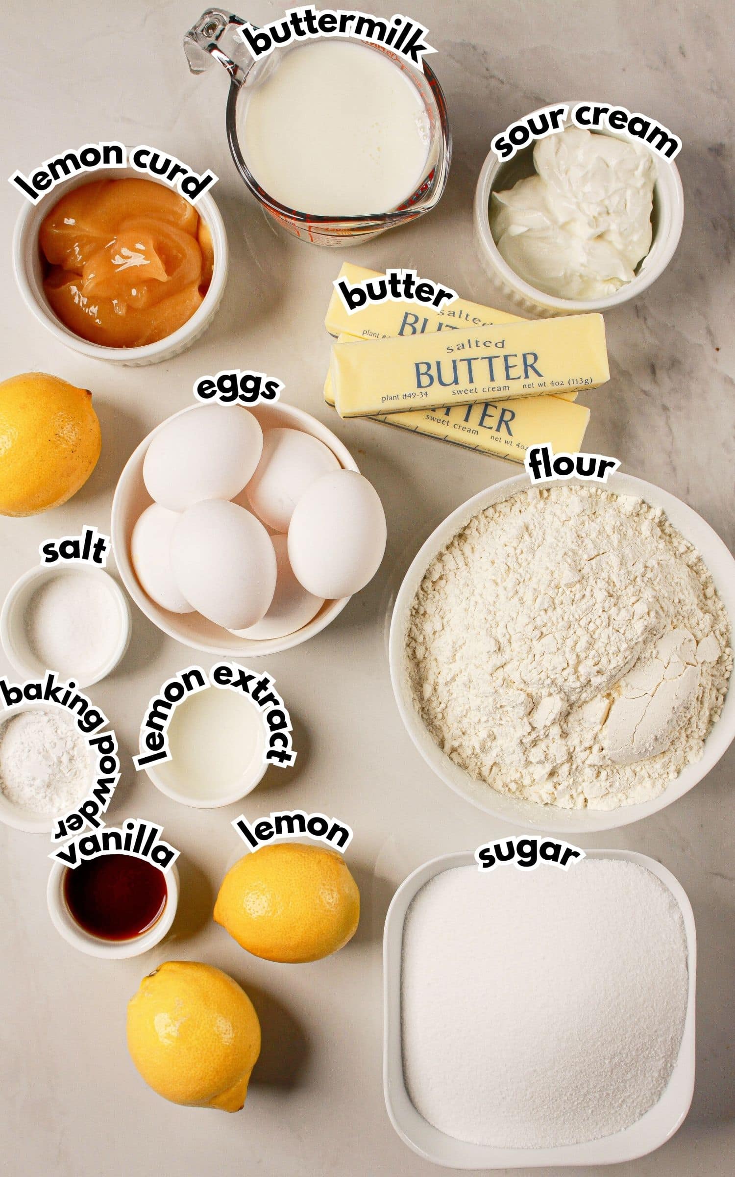 Bowls of ingredients labelled with text on a counter.