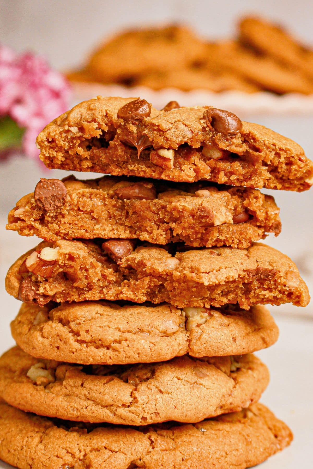 Peanut butter chocolate chip cookies stacked on top of each other.