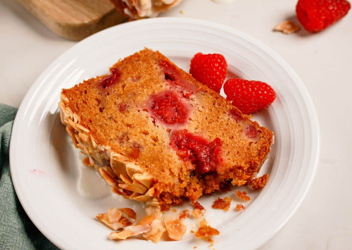 Slice of raspberry bread on a white plate.