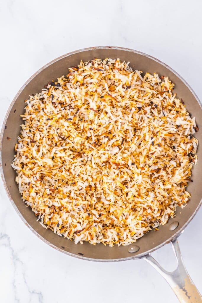 Toasted coconut in a large skillet.