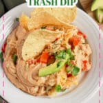 Plate full of Texas trash dip with tortilla chips.