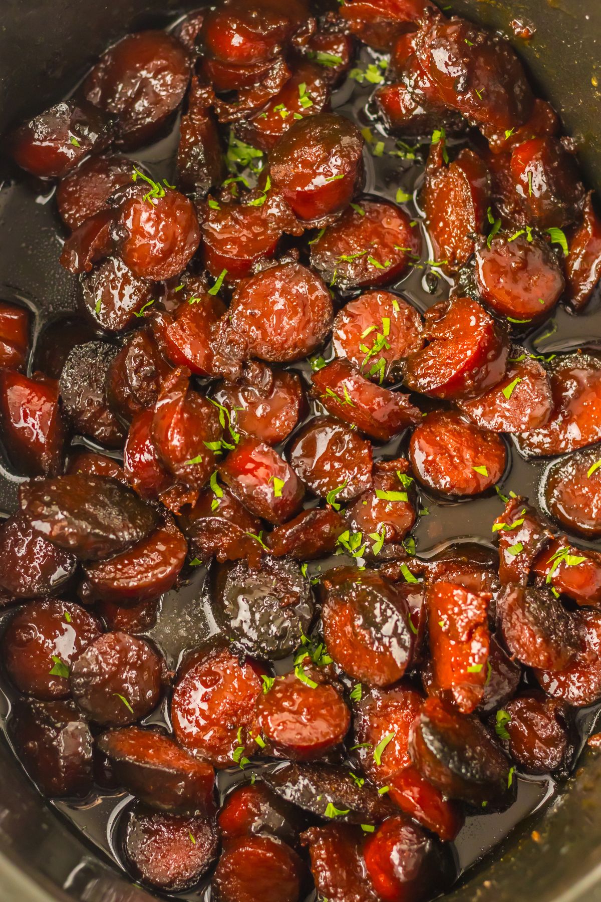 Cooked smoked sausage in a crock pot.