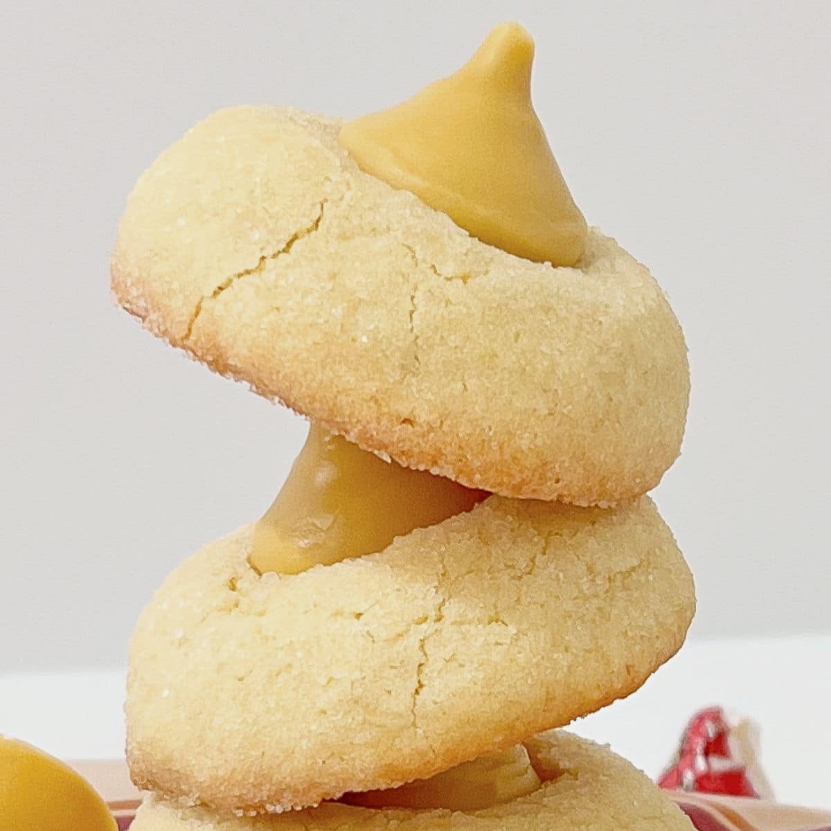 Three butterbeer blossom cookies stacked on top of each other.