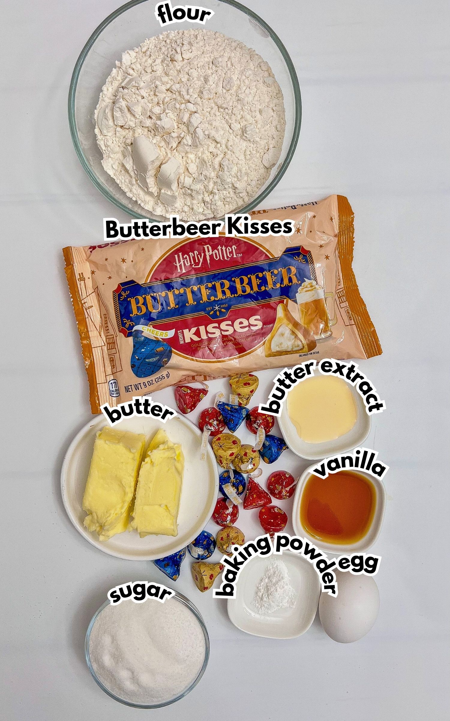 Bowls of ingredients labelled with text on a counter.