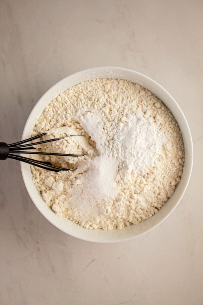 Dry ingredients being mixed into a bowl.