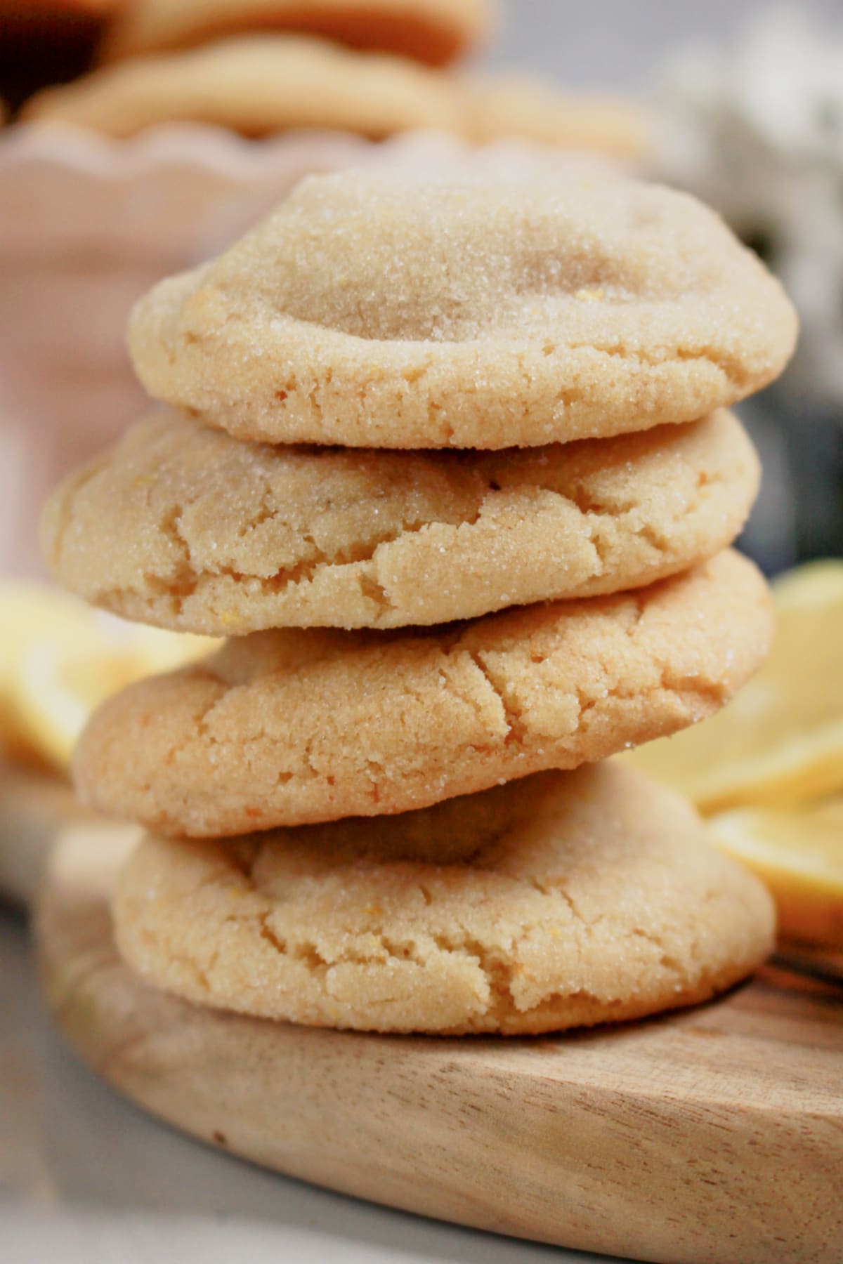 Four chewy lemon sugar cookies stacked on top of each other.