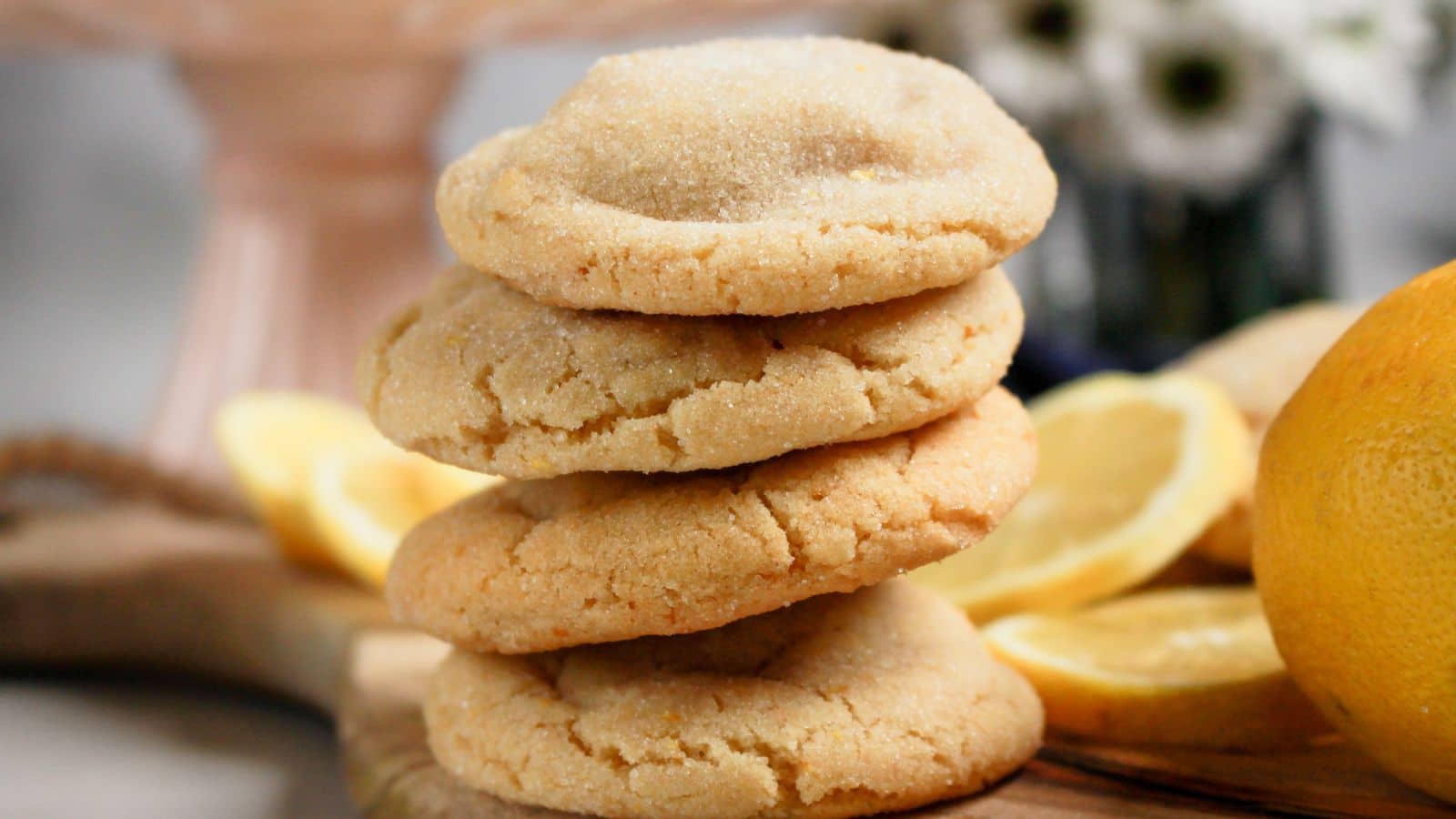 Four chewy lemon sugar cookies stacked on top of each other.