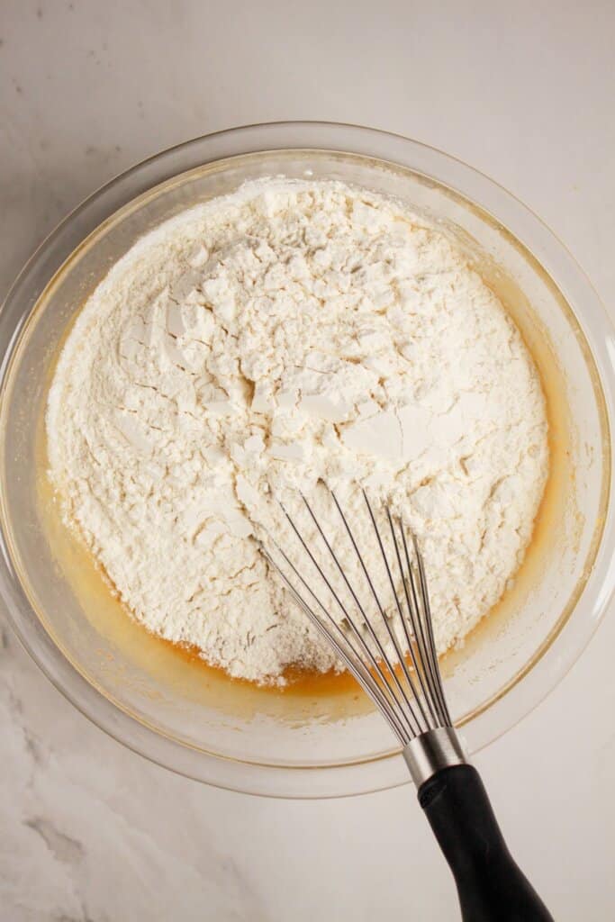 Dry ingredients being mixed into batter.