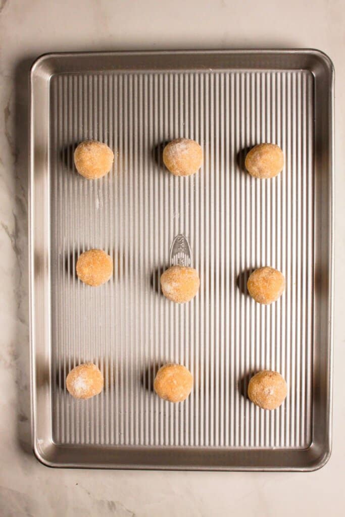 Dough balls in a baking pan.
