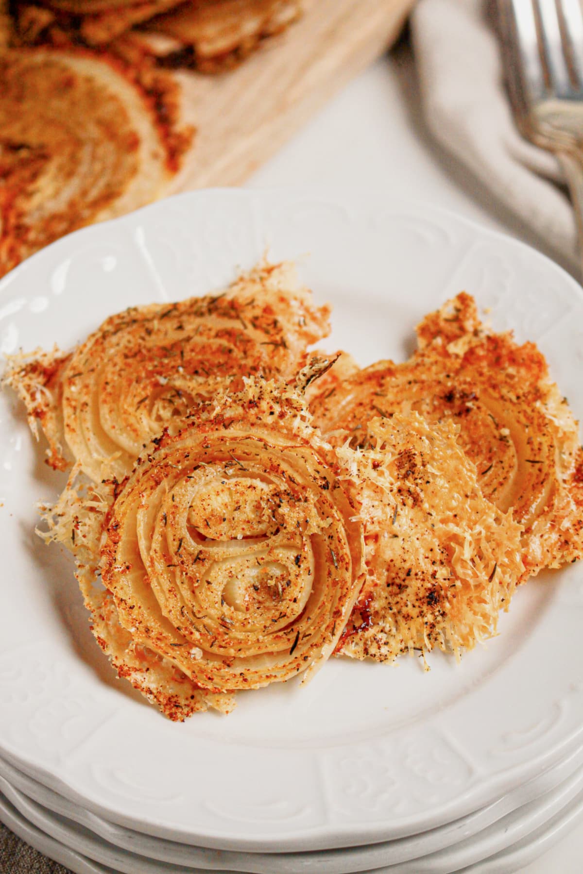 Onion ring chips on a white plate.