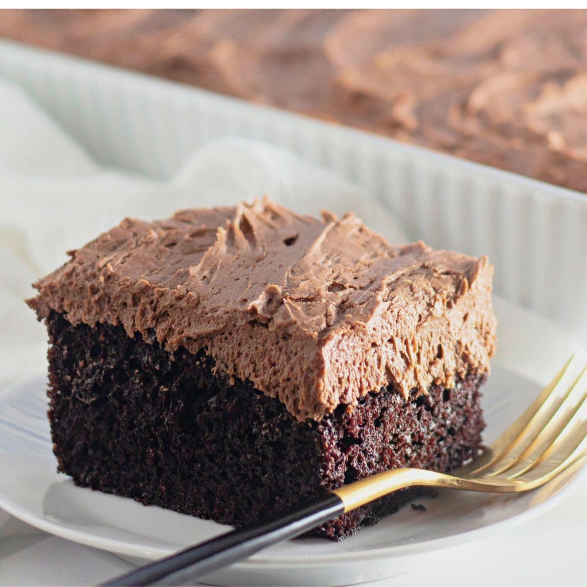 Slice of easy chocolate cake on a small plate.