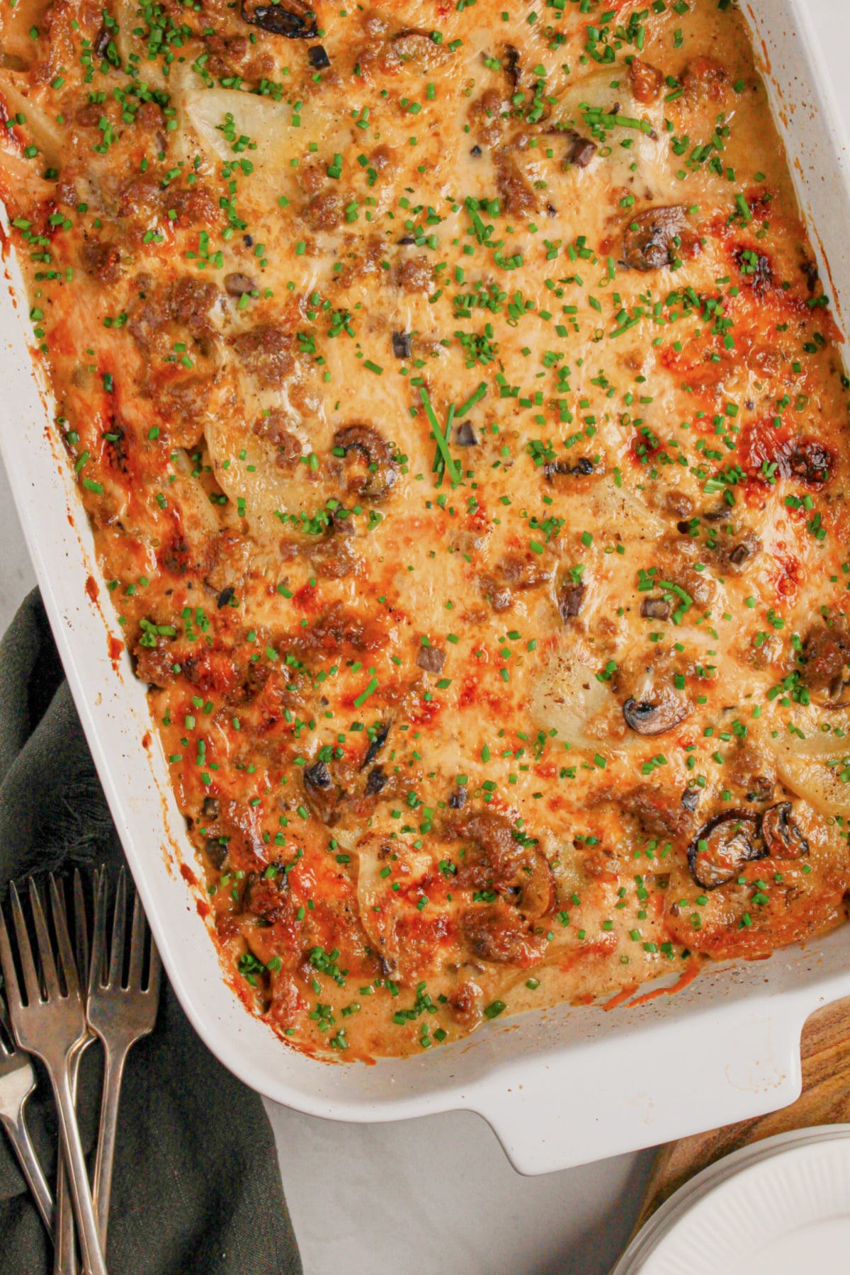 Baking dish full of ground beef and potato casserole.