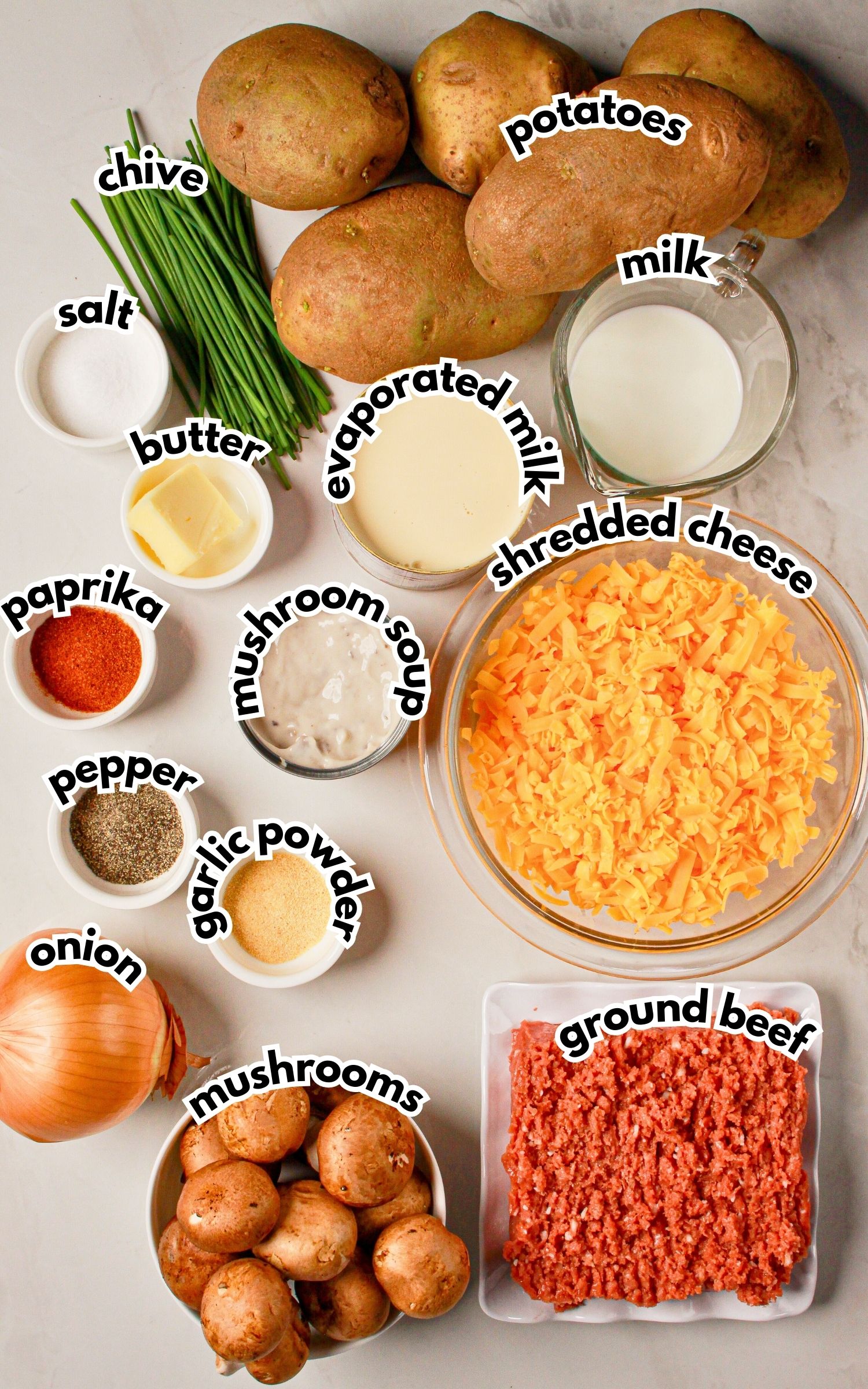 Bowls of ingredients labelled with text on a counter.
