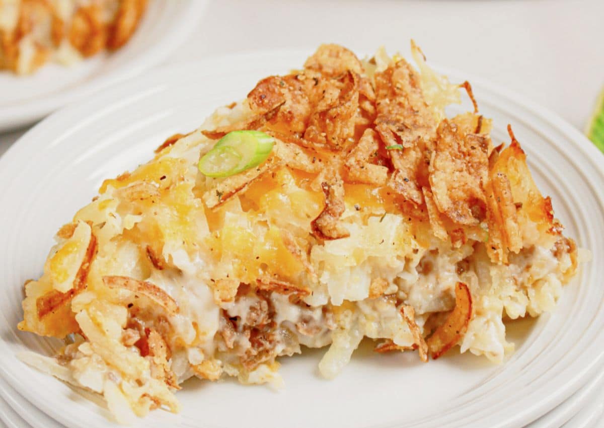 Slice of hobo casserole on a small white plate.