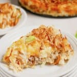 Slice of hobo casserole on a small white plate.