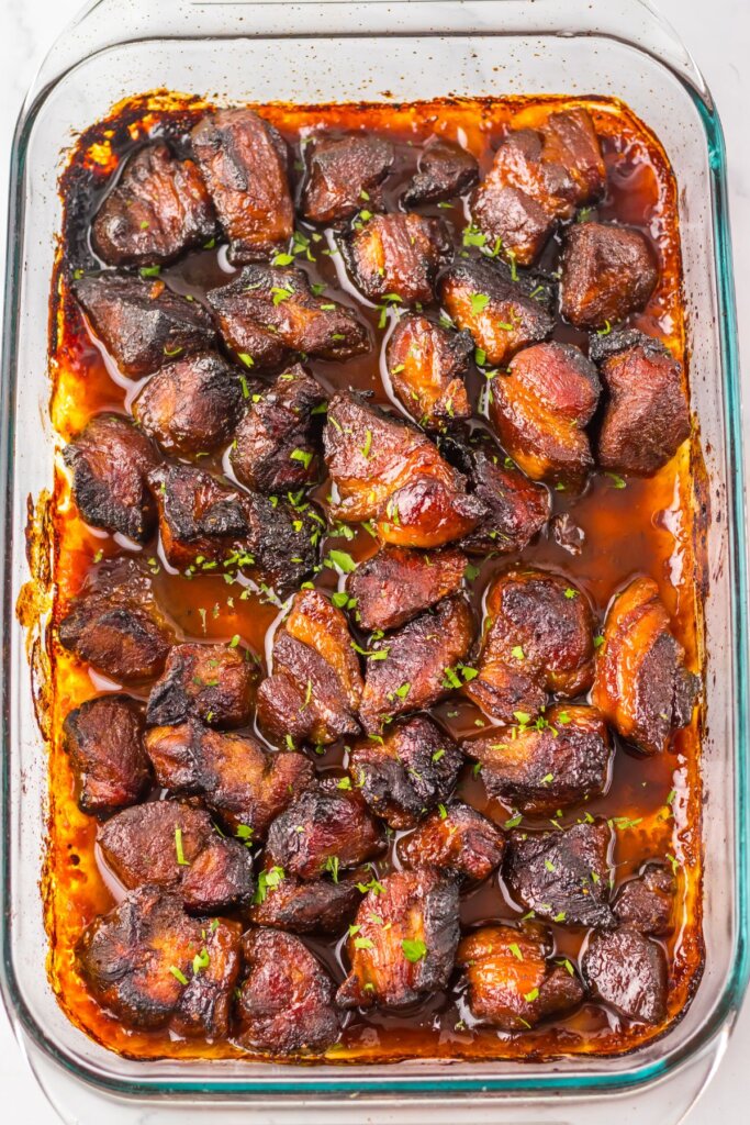 Cooked meat in a glass baking dish.