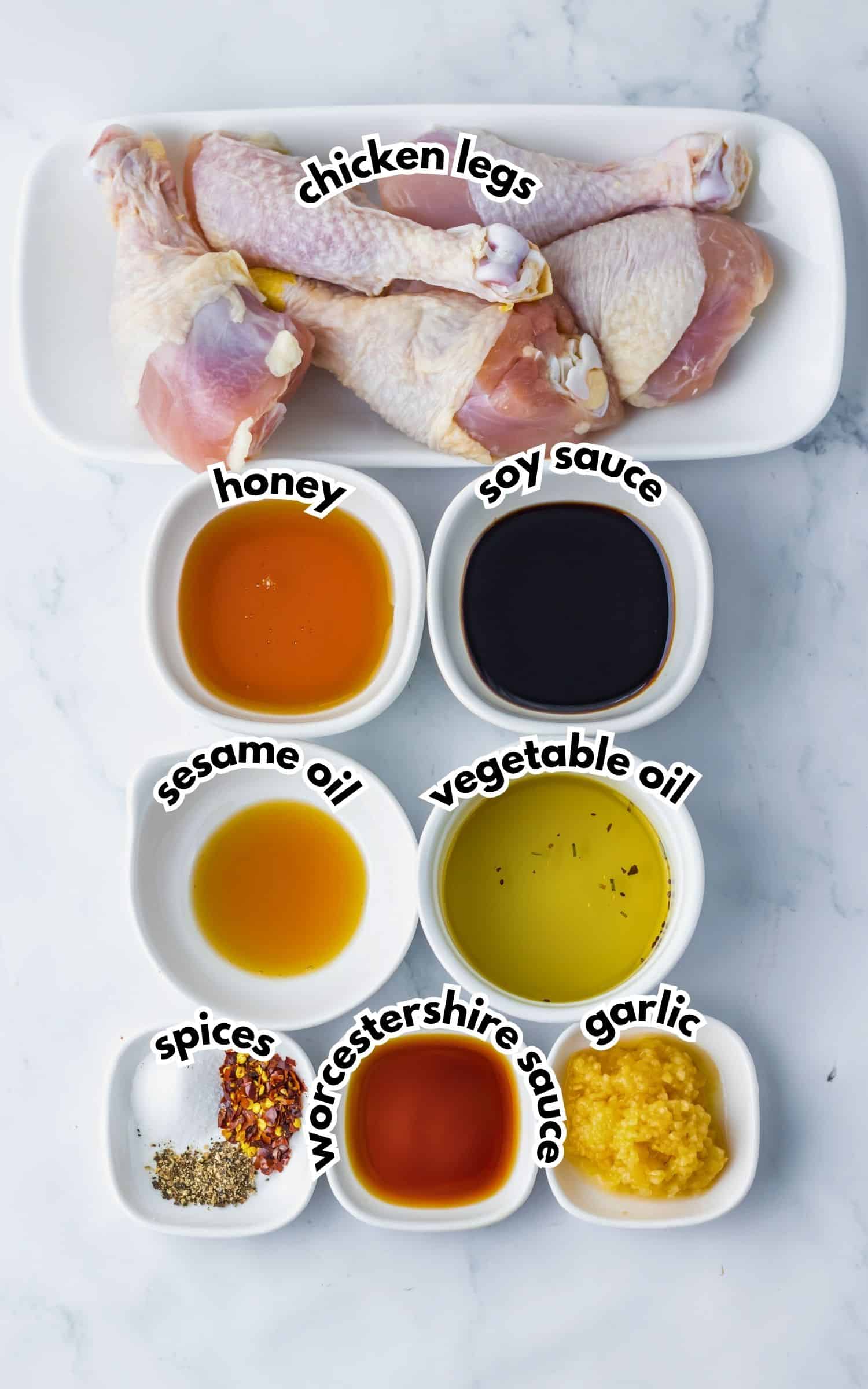 Bowls of ingredients labelled with text on a counter.