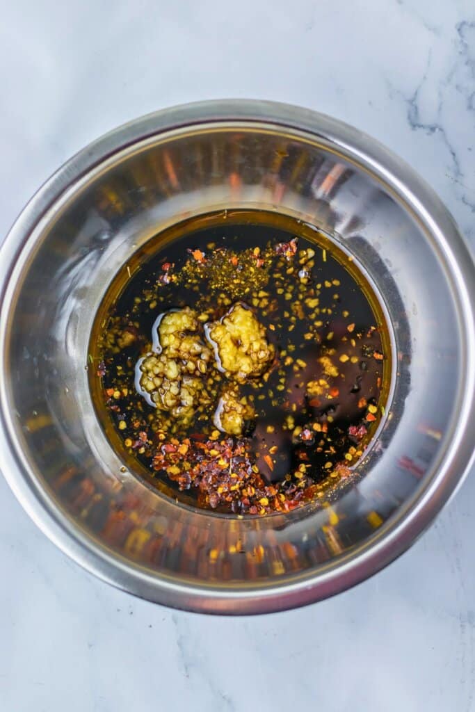 Marinade in a stainless steel mixing bowl.