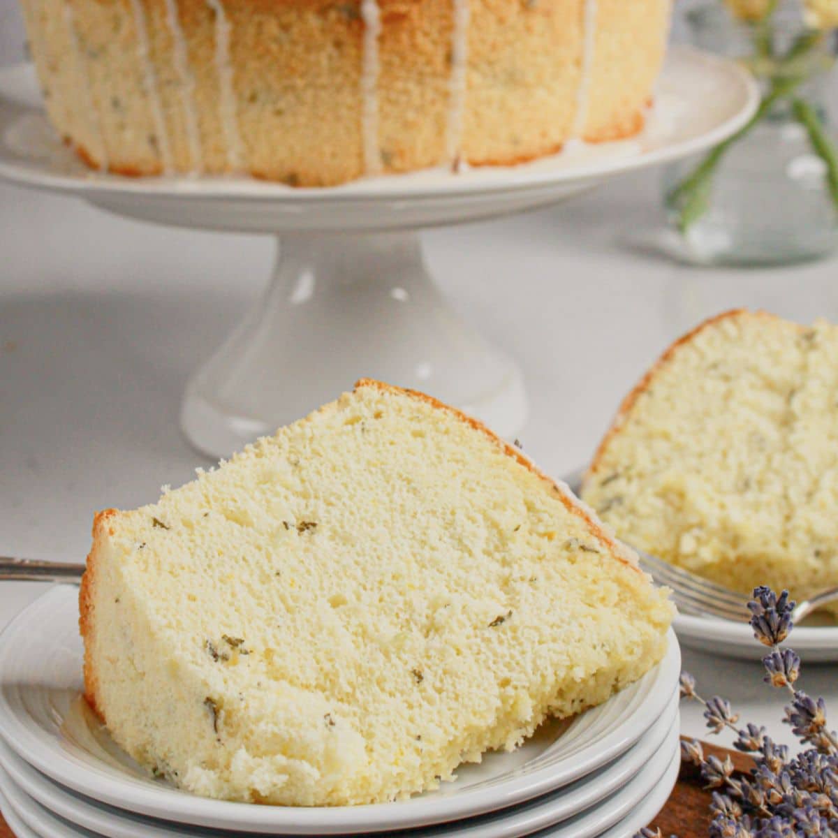 Slice of lemon chiffon cake on a small plate.