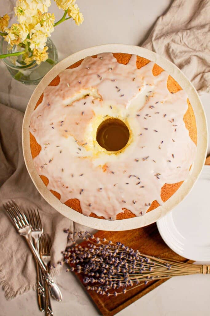 Drizzle being poured on top of cake.