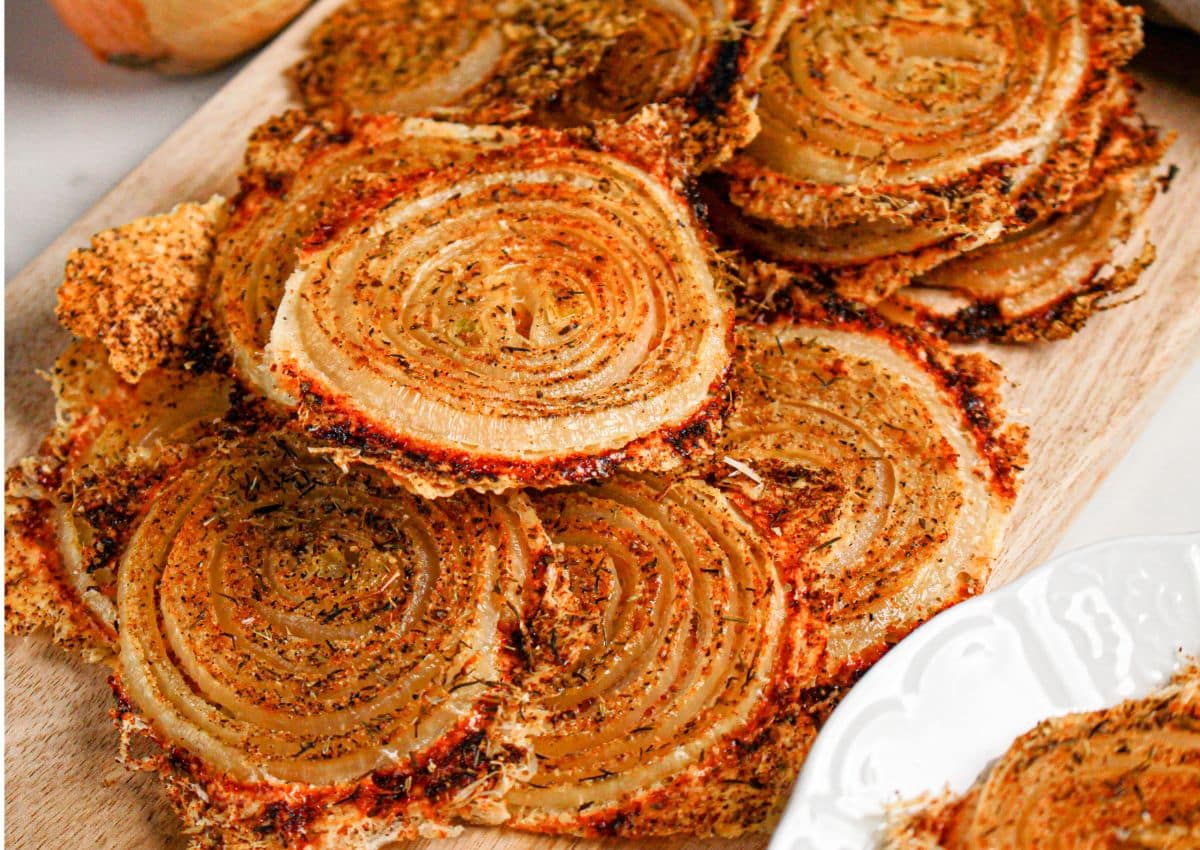 Onion ring chips on a white plate.
