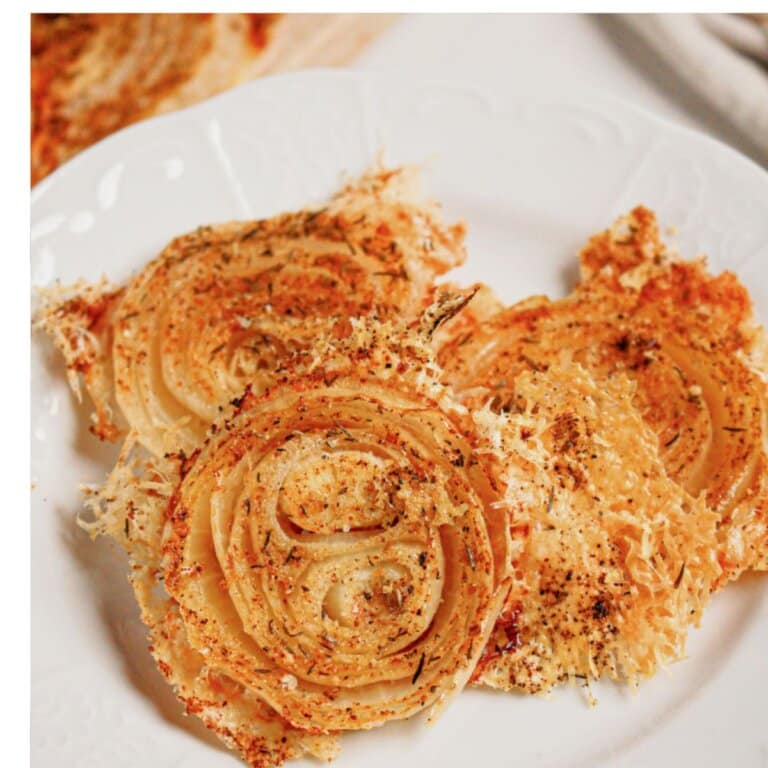Onion ring chips on a white plate.