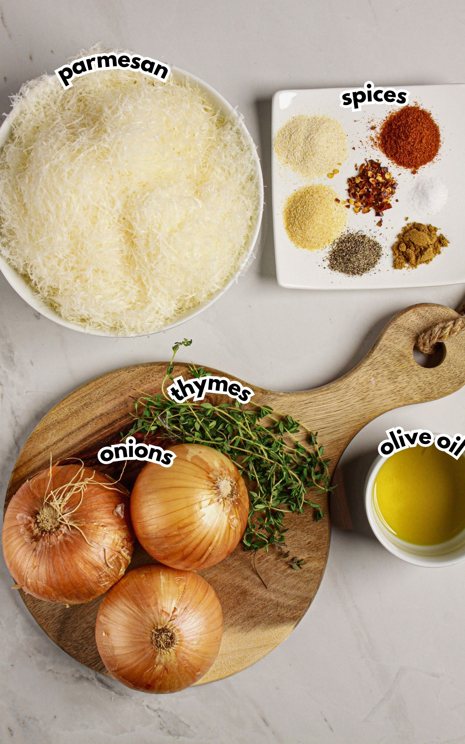 Bowls of ingredients labeled with text on a counter.