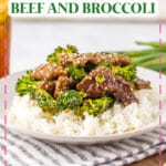 White plate with rice topped with beef and broccoli.