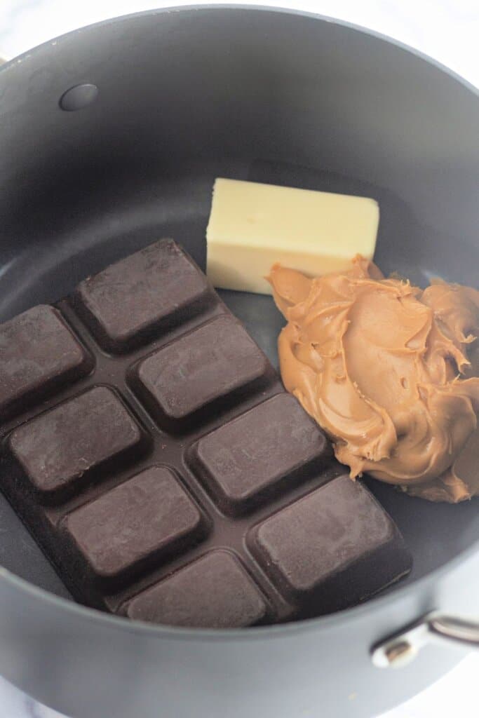 Chocolate, butter, and peanut butter in a large pot.