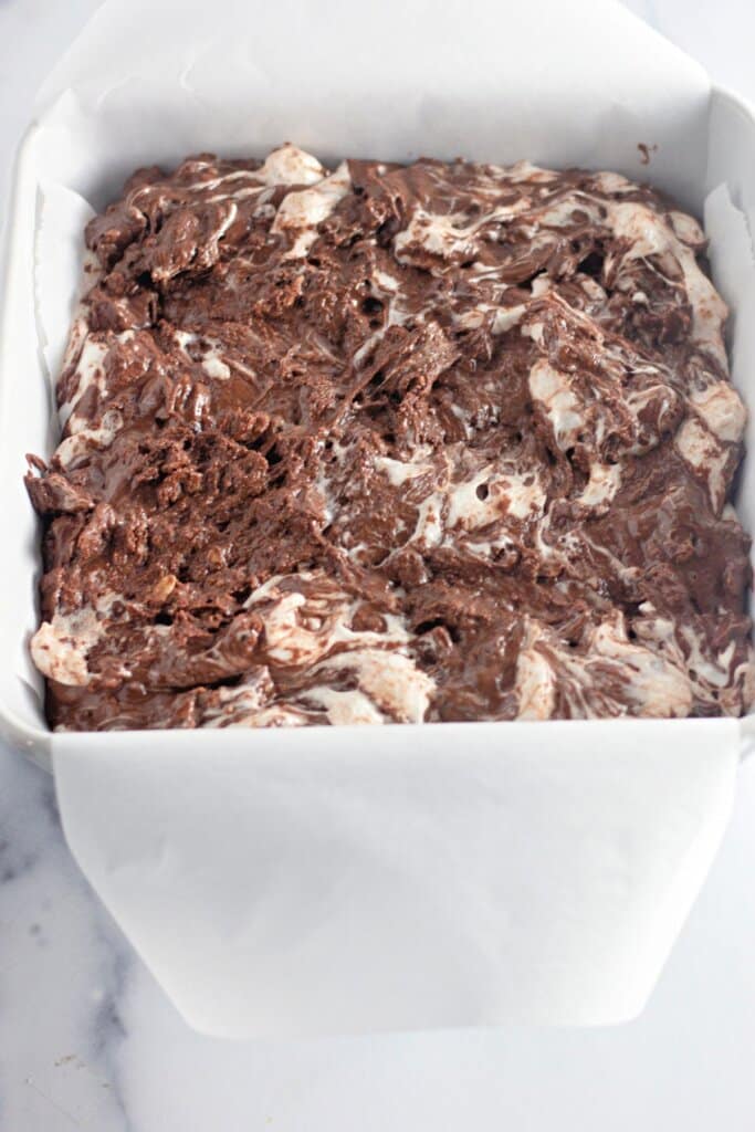 Chocolate and marshmallow mixture in a baking dish.